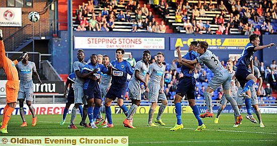 Timothee Dieng (third right) scores from a corner.