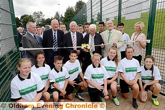 Opening ceremony of the new Failsworth Sports Campus at Failsworth School. Front row cutting the ribbon are left to right, head teacher John Meagher, Bernard Halford, former Manchester City players Mike Summerbee, Tony Book, Rt. Hon.Lord Pendry P.C., Natalie Craig, integrated facilities manager.