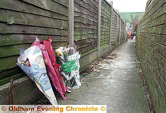 FLOWERS left at the High Crompton murder scene