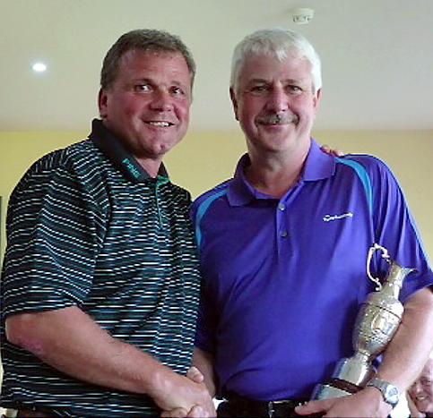 Simon Halliwell receives the captain’s trophy at Saddleworth from Andy Dunster (Captain).
