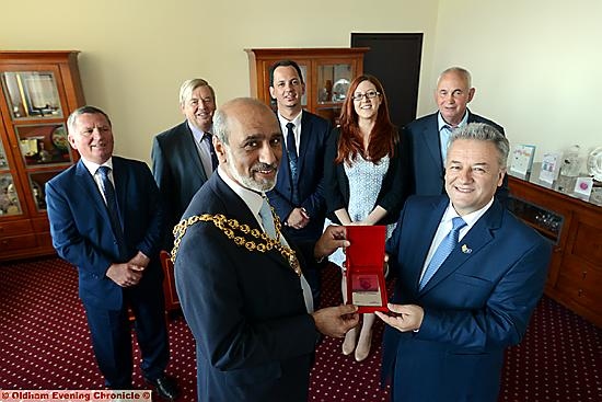 The Mayor of Oldham Cllr. Fida Hussain (left) meets the Mayor of the Municipality of Ferijaz, Republic of Kosovo, Muharrem Svarqa. In the background are left to right, Faik Graica, John Battye (the Oldham Mayor in 1999 who greeted the first group of Kosovan refugees), Burim Karameta, Ailsa Plain (Foreign and Commonwealth Office), Osman Caka (one the first refugees).