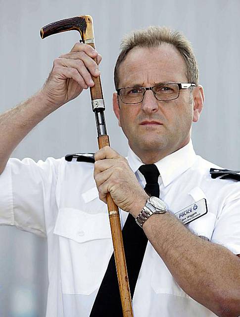 Shotgun disguised as walking stick handed in to GMP. Pictured Assistant Chief Constable Ian Wiggett