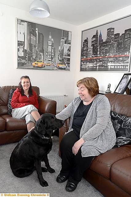 Progress pic of Crossley estate, Chadderton during major refurbishment. Pic shows Petworth Road resident, partially-sighted Katherine Haslam (right) with her personal assistant Caroline Moloney and guide dog Bea.
