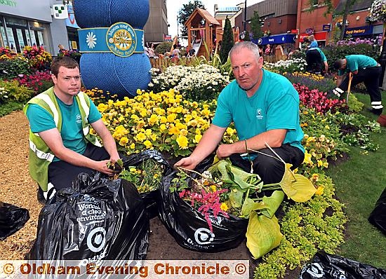 Andrew Marsland (gardener) and Lee Gannon (Bloom and Grow Team Leader) with bags of destroyed plants.
