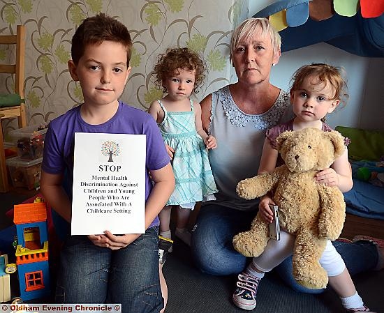 Childminder Susan Radcliffe is worried that she may have to stop looking after children. Pic with some of her charges left to right, Archie Green (8), Melody Topham (20 months), Abbie Irvine (3).