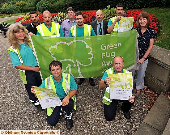 Alexandra Park retains its green-flag status. Front (stood) L-R: Andrea Blackman (glasshouse operartive) and Cllr Barbara Brownridge.

Staff at front with certificates L-R: Max Foster and Paul Jones.

Other parks department staff behind.