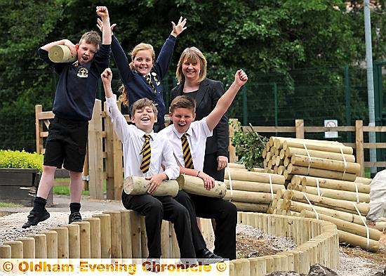 St Anne’s Primary School, Lydgate pupils celebrate the imminent arrival of their new “peace garden”. Pictured from left to right are James Lomas, Eleanor Cocking, Suzanne Bergin (project co-ordinator). Front, Izaac Gater and Ben Killan