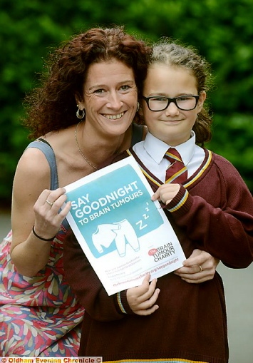 BRAVE little girl . . . Katie McGann and her proud mum Marie support the charity after Katie was diagnosed with an inoperable brain tumour last year