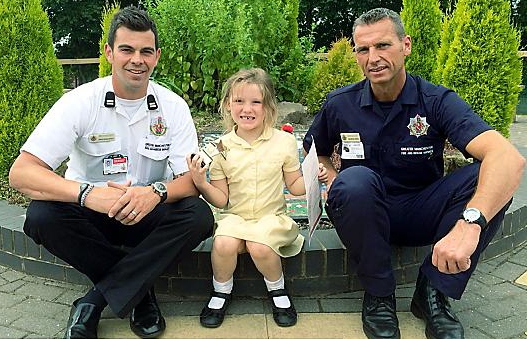 Ellie and her awards with Simon Wheelwright and Graham Cooper from Chadderton Fire Station