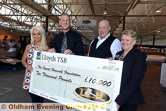 Presentation of £10,000 to the Stuart Howarth Foundation by TLH Auctioneers, Chadderton to go towards the Stuart Howarth Wellbeing and Fitness Centre Ltd. Cancer sufferer Stuart (2nd left) receives the cheque from TLH staff left to right, Emily Higham, Dave Shore (manager), Hazel Slater.