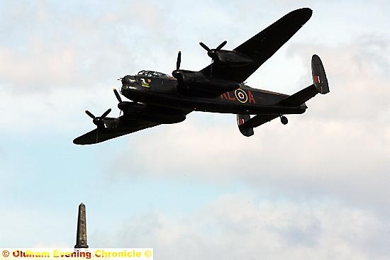 A Lancaster bomber from the Second World War flies over Uppermill during Yanks Weekend.