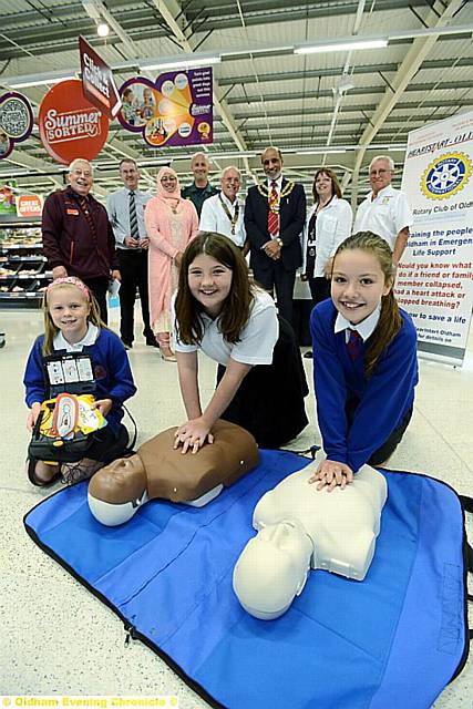 Oldham Rotary charity Heartstart has been chosen as Sainsbury's Charity of the Year. Pic shows in foreground left to right, pupils from Crompton Primary School, which has a Heartstart programme, Maizey Taylor, Lydia Burgess, Olivia Clifford. Standing behind are the Mayor Cllr. Fida Hussain and Mayoress Tanvir Hussain with president of Oldham Rotary John Ashworth, members of Heartstart, Sainsbury and the NHS.