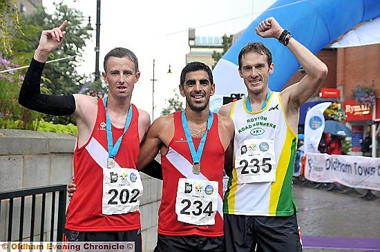 FROM LEFT: Winner Bruno Lima (Salford Harriers flanked by teammate and runner-up Glyn Billington (left) and third-placed Russell Ingham (Royton Runners).