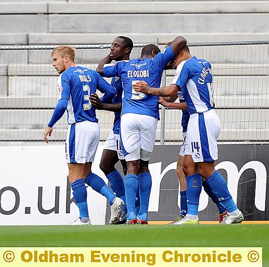 WELL DONE, MATE . . . Jonathan Forte is congratulated by his Athletic team-mates after opening the scoring in the 16th minute.