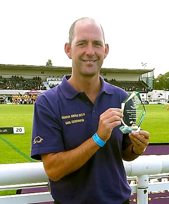 ALL SMILES: Gary Melling shows off his North-West Rugby League teacher of the year award.