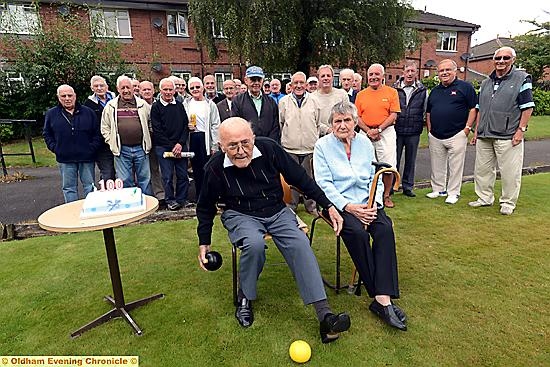 LANDMARK: George Glass and wife Gladys celebrate George’s 100th birthday with members of Brookdale bowls club.