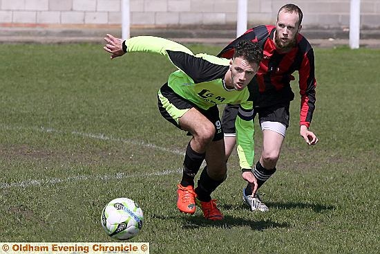 TIME FOR ACTION: Rifle Range’s Nathan Barker (front) and Dog and Partridge’s Christan Shermerdine battle for the ball during an Oldham Sunday League clash last season.