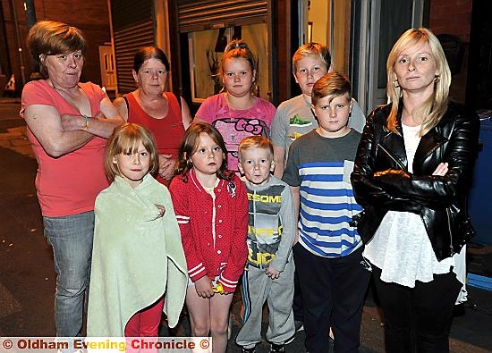 Lisa Casey (right) with her children and neighbours.