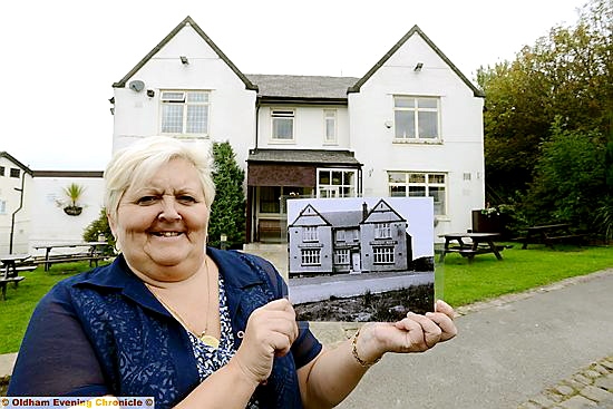 ORGANISER Joan Hague with a photo of her pub taken in June 1965