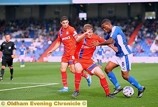 WITH the ball at his feet, Athletic forward Dominic Poleon attacks the Gillingham back line.