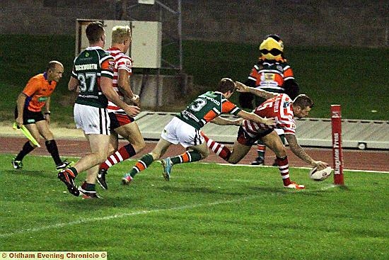 IN AT THE CORNER: Roughyeds winger Dale Bloomfield touches down early in the second half to pull his side back within a point of the Hawks. 