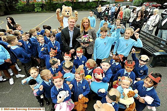 pupils at Firwood Manor preparatory school with footballer Paul Scholes and his wife Claire.