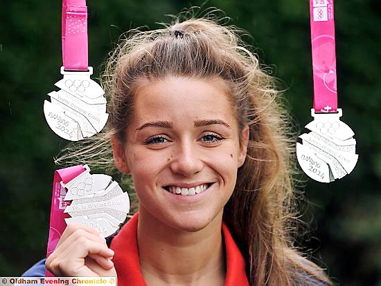 BIG SMILE: Jessica Fullalove shows off her three Youth Olympic silver medals. 