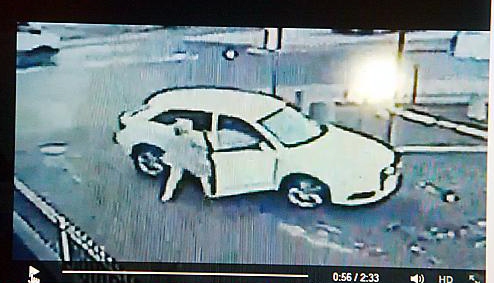 BRAVE . . . Deborah grapples with the would-be thief in an image caught on CCTV