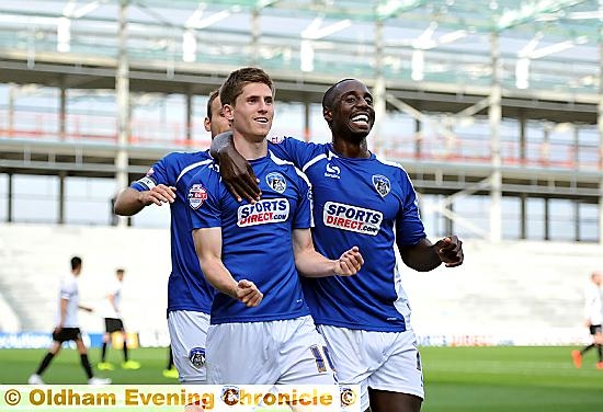 OH YES . . . Danny Philliskirk celebrates his first goal against Scunthope with Jonathan Forte.