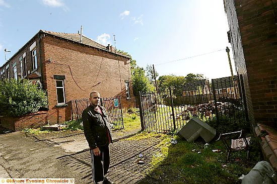 DISBELIEF . . . Khizar Iqbal in front of the land where a three-bedroom property will be built