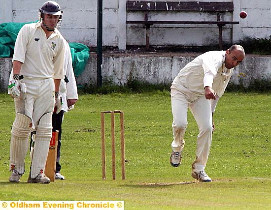 GLODWICK’S Imran Asghar strives for a wicket.