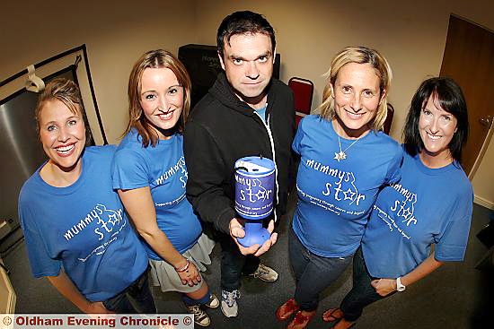 Eva Royle (second-right) and her Mummy’s Star fund-raisers with Robbie Williams tribute act JK.