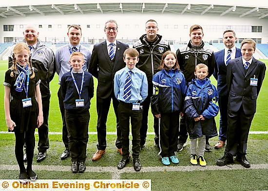 OURS for the day: kids take over from Latics backroom boys.