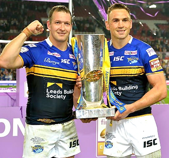 MINE’S A TREBLE: Kevin Sinfield (right) celebrates with his Rhinos team-mate Danny McGuire.