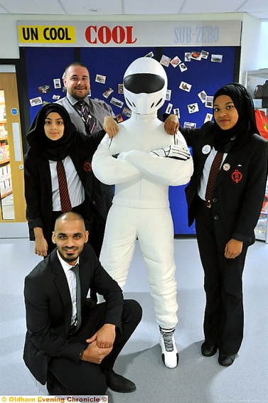 cool: The Stig with, from left, Miriam Majeed, Graeme Munro (design and technology teacher), Nana-Nabiha Yussuf and in front, artist Javed Saddique