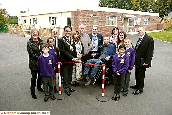 the Mayor and Mayoress, Councillor Ateeque Ur-Rehman and Yasmin Toor, are pictured with Andy Walker, staff, governors, guests and pupils at the ribbon-cutting ceremony