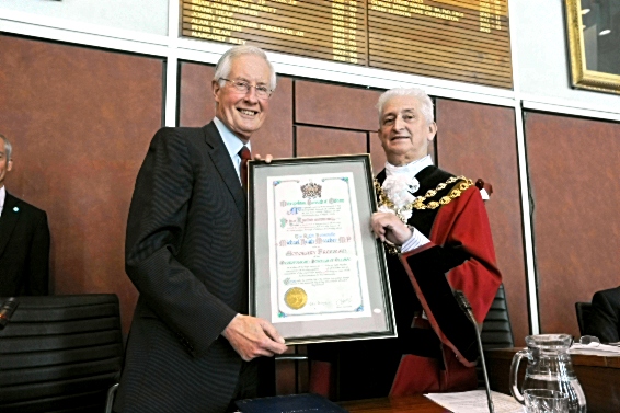 Michael Meacher receiving the Freedom of the Borough in 2013 from then Mayor, Councillor John Hudson