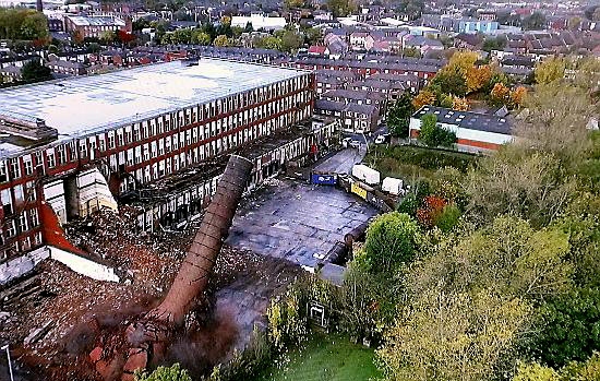 GOING: these pictures taken from a camera on a drone craft show the chimney collapse after 110 years