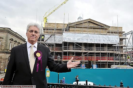 UKIP by election candidate John Bickley outside Town Hall development in Oldham.