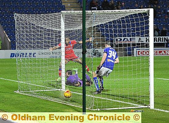 IT’S THERE . . . Dominic Poleon squeezes home Athletic’s equaliser.