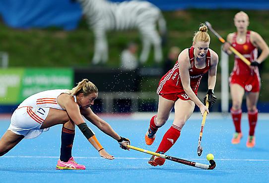 England's Nicola White (right) battles for the ball during the Gold Medal match at the Lee Valley Hockey and Tennis Centre, London.