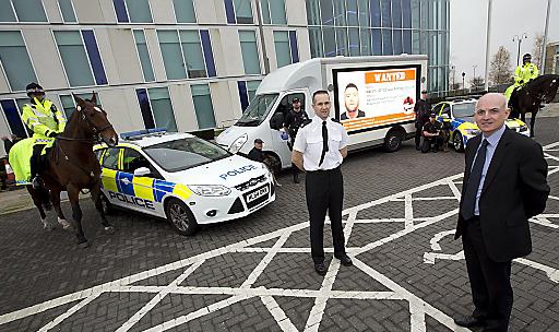 Van broadcasting the faces of individuals wanted by GMP