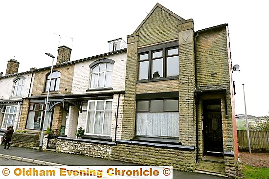DANGER properties . . . the end terrace house in Moss Bank, Queen Street