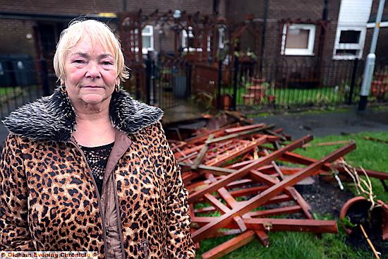 Joan Williams in the garden that became a memorial to her sister, now wrecked by vandals
