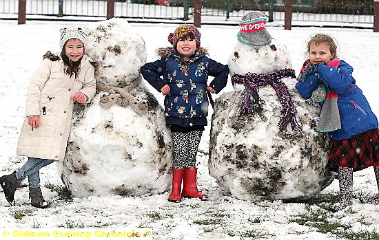 THE snow wasn’t bad news for everyone: (l-r) Ella Highton (5) and Maddison Highton (4) and Eloise Mae-Henry (6), built their snowmen in Uppermill.