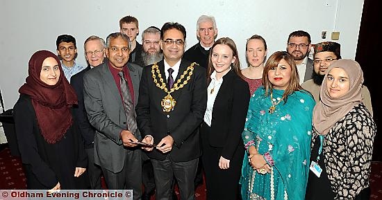 UNITED . . . Oldham Interfaith Forum chairman Ravji Patel and Oldham Mayor Councillor Ateeque Ur-Rehman (centre) with faith leaders