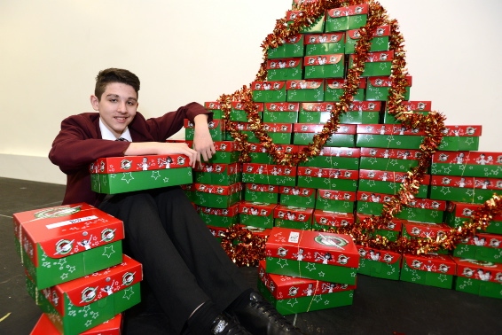 Christmas message: Kevin Kociu with some of the shoeboxes collected at Hathershaw College