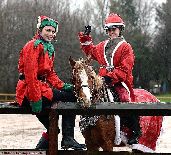 Kirsty Fielding and Ellie Stansfield dressed as elves with horse Maggie