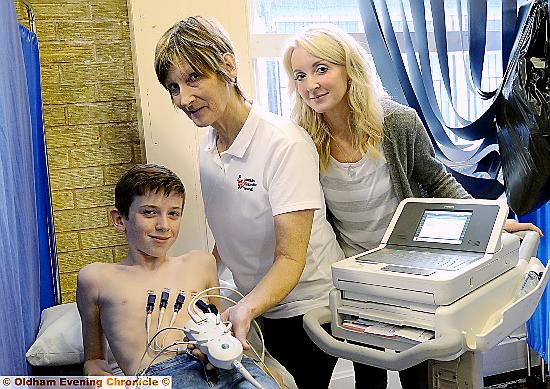 Debbie Dubois - mother of the late Harry - watches as her nephew Joseph Gidley is screened by nurse Sheila Pitt.