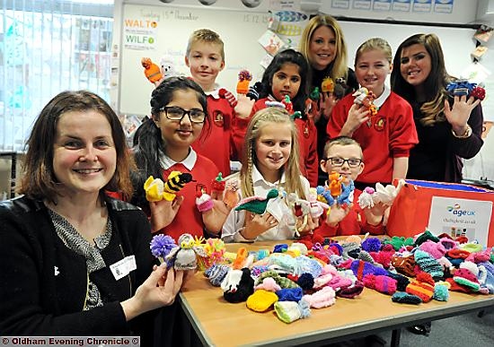 GET KNITTING: Pupils from Knowsley Junior School and their woolly goods. Rear l-r Billy Midgley, Sana Rashid, Ellen Aldred (assistant head), Emily Saville and Jade Phillips (Charity Co-ordinator). FRONT: Nicola Shore (Age UK Oldham), Ria Rashid, Emily Moule and Ben Saville.

CONTACT Jade Phillips (Charity Co-ordinator) art school.